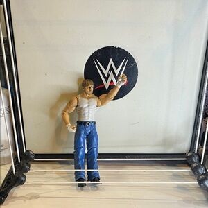 WWE Action Figure with Blue Pants and White Top